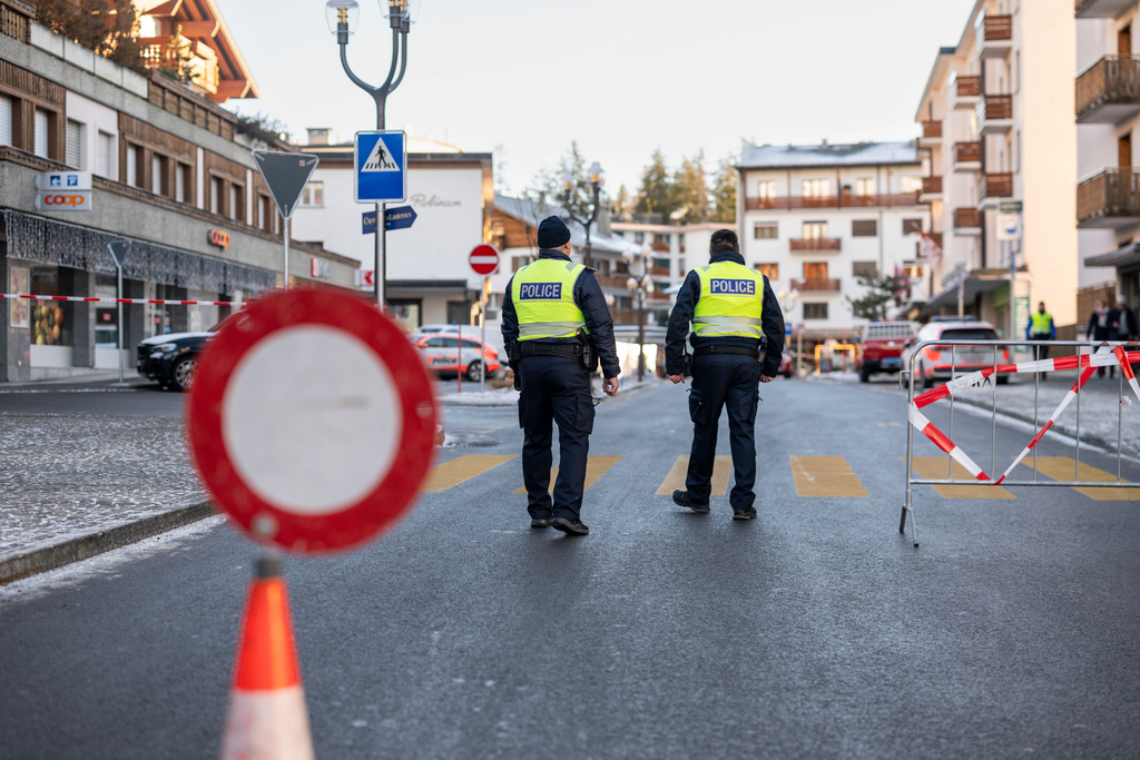 Police officers inspect the area where a fire broke out at the Le Constellation bar and lounge leaving people dead and injured, during New Year’s celebration, in Crans-Montana, Swiss Alps, Switzerland, Thursday, Jan. 1, 2026. (Alessandro della Valle/Keystone via AP)