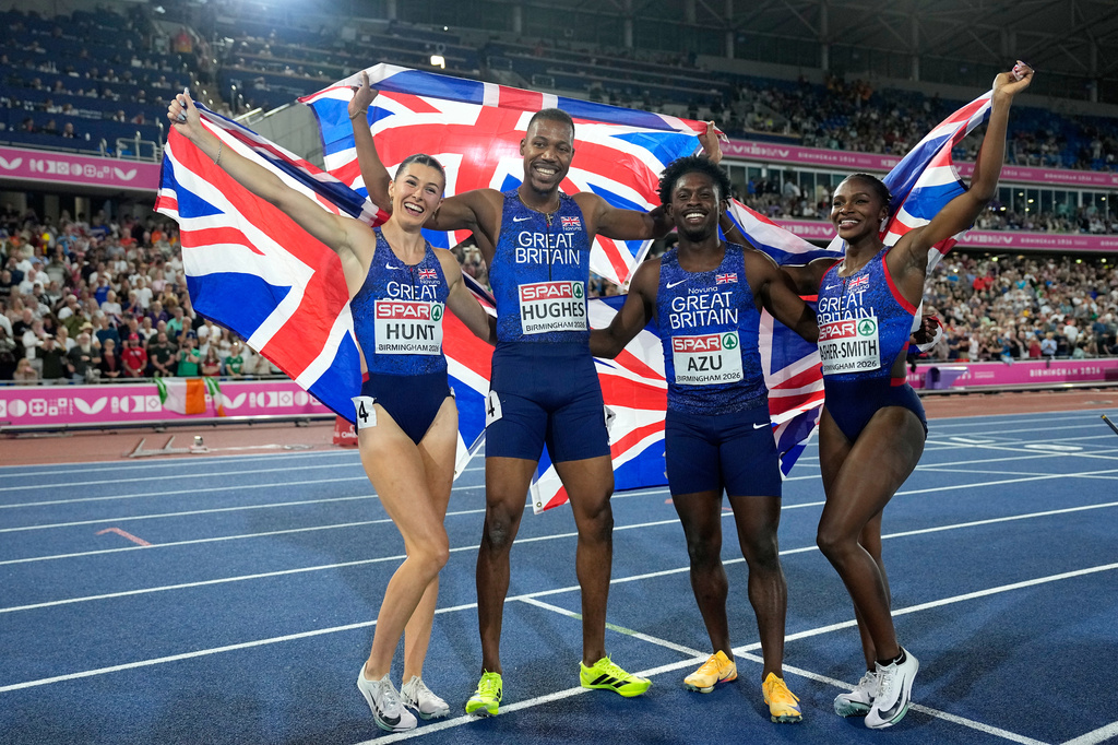Britain's Jeremiah Azu, Dina Asher-Smith, Zharnel Hughes and Amy Hunt pose after winning the mixed 4 X 100 meters relay final setting a new European record at the European Athletics Championships in Birmingham, England, Sunday, Aug. 16, 2026. (AP Photo/Matthias Schrader)