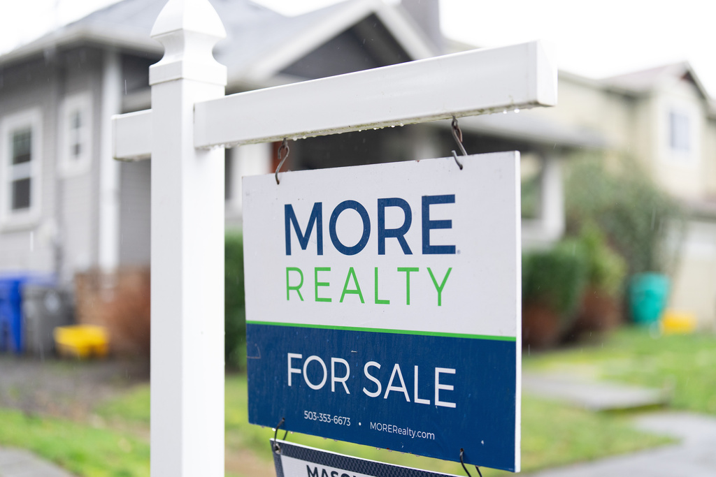 A "For Sale" sign is seen on Tuesday, Jan. 6, 2026, in Portland, Ore. (AP Photo/Jenny Kane)