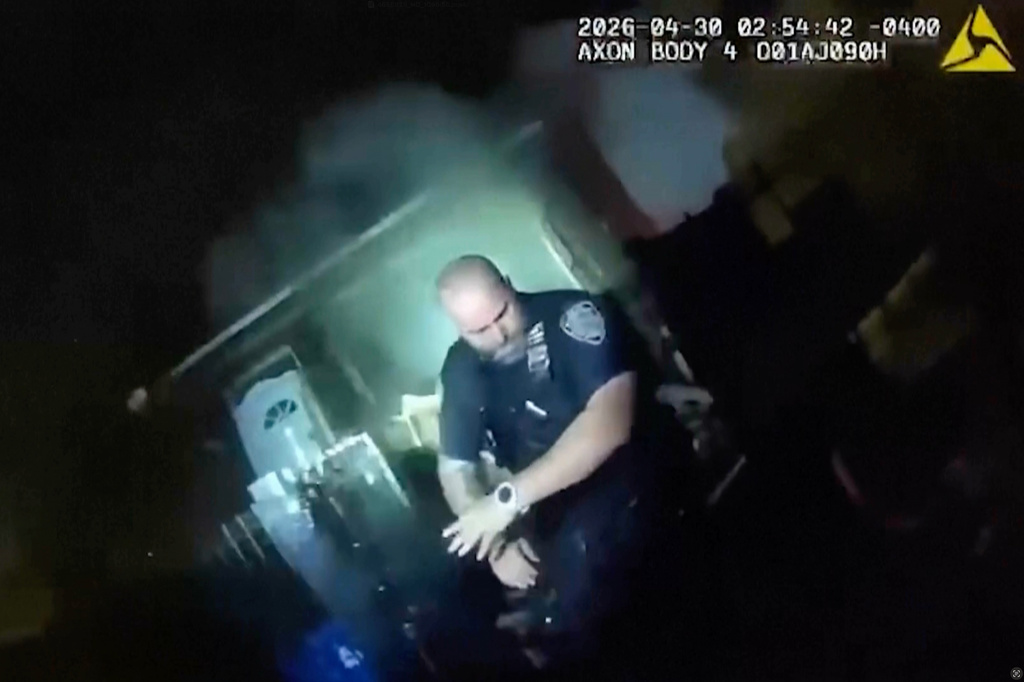 This image made from New York Police Department body camera video shows an officer after an explosion at a house while responding to a call of an armed man Thursday, April 30, 2026, in the Queens borough of New York. (New York Police Department via AP)