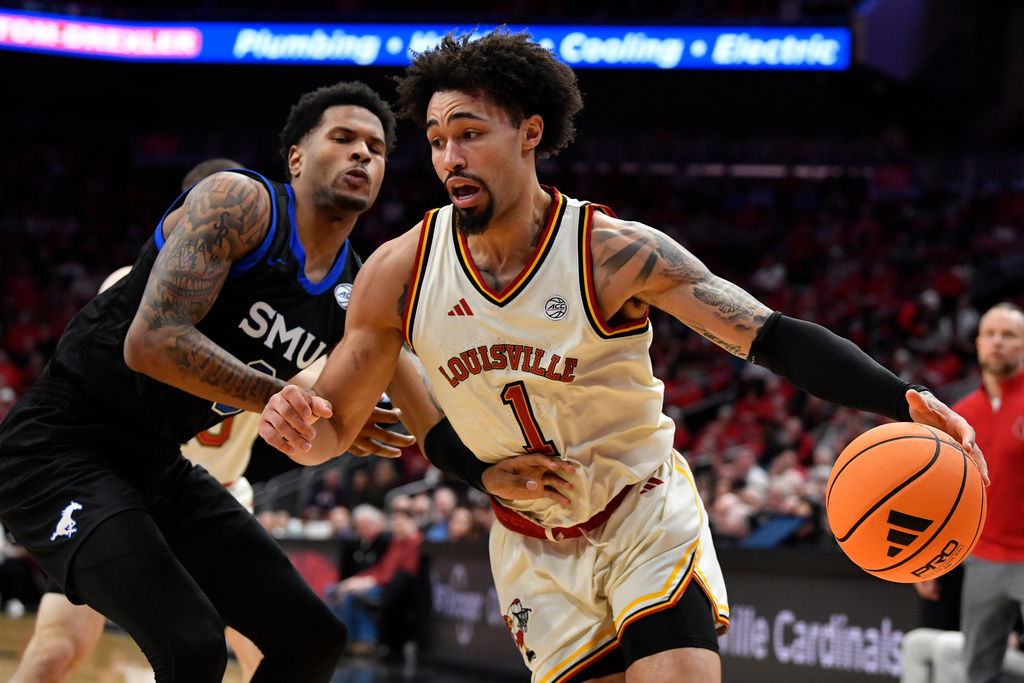 Louisville guard J'vonne Hadley (1) drives against SMU forward Corey Washington (3) during the second half of an NCAA college basketball game in Louisville, Ky., Saturday, Jan. 31, 2026. (AP Photo/Timothy D. Easley)