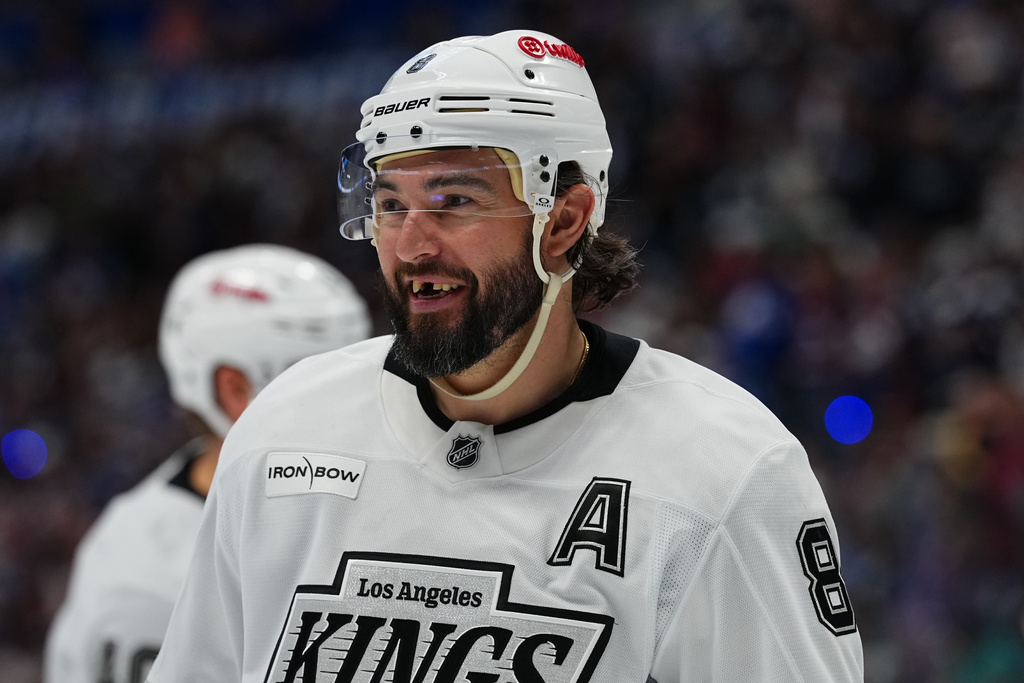 FILE - Los Angeles Kings defenseman Drew Doughty smiles while the glass is replaced behind the team's bench during the second period of Game 2 in the first round of the NHL hockey Stanley Cup playoffs against the Colorado Avalanche, Tuesday, April 21, 2026, in Denver. (AP Photo Jack Dempsey,File)