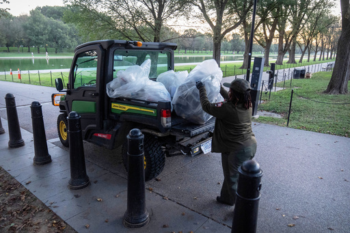 A National Park Service employee loads a utility vehicle with bags of trash along the National Mall on Wednesday, Oct. 1, 2025, in Washington. (AP Photo/Mark Schiefelbein) A National Park Service employee loads a utility vehicle with bags of trash along the National Mall on Wednesday, Oct. 1, 2025, in Washington. (AP Photo/Mark Schiefelbein)
