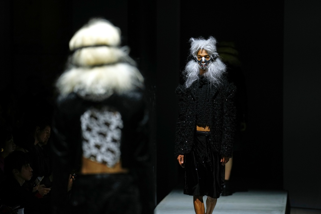 Models wear creations as part of the Comme des Garcons Fall/Winter 2026-2027 Men's collection presented in Paris, Friday, Jan. 23, 2026. (AP Photo/Aurelien Morissard)