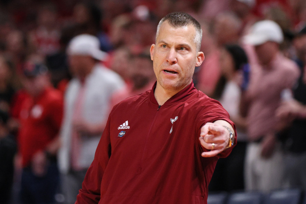 FILE - Troy head coach Scott Cross points during the second half of the NCAA college basketball tournament March 19, 2026, in Oklahoma City. (AP Photo/Nate Billings, File)