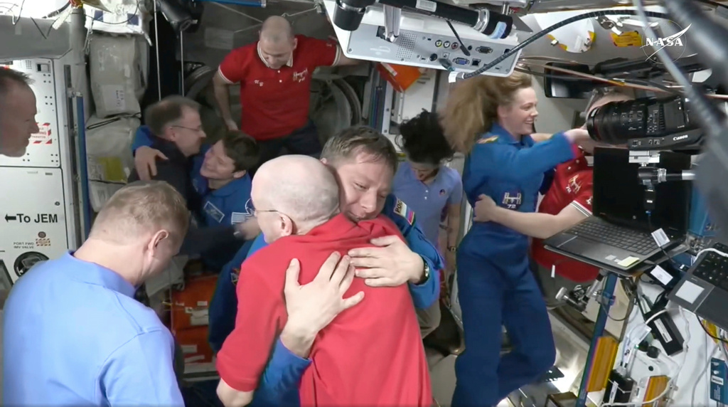 FILE - In this image from video provided by NASA, astronaut Don Pettit, bottom center, hugs Kirill Peskov as astronauts greet each other after a SpaceX capsule docked with the International Space Station, Sunday, March 16, 2025. (NASA via AP, File)