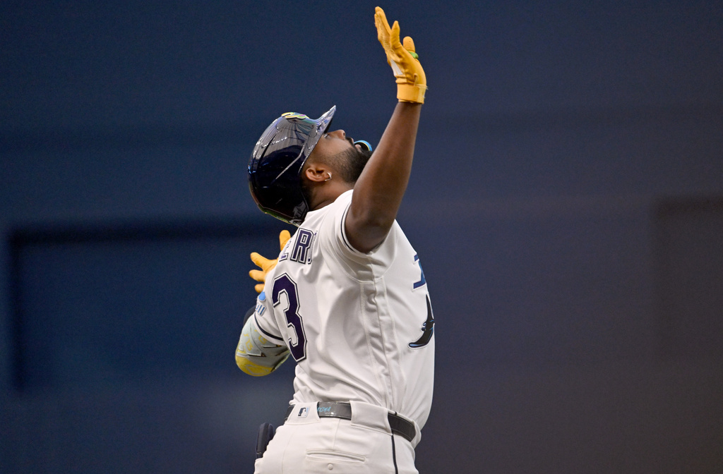 Tampa Bay Rays' Junior Caminero celebrates after his solo home run during the first inning of a baseball game against the Minnesota Twins, Friday, April 24, 2026, in St. Petersburg, Fla. (AP Photo/Jason Behnken)