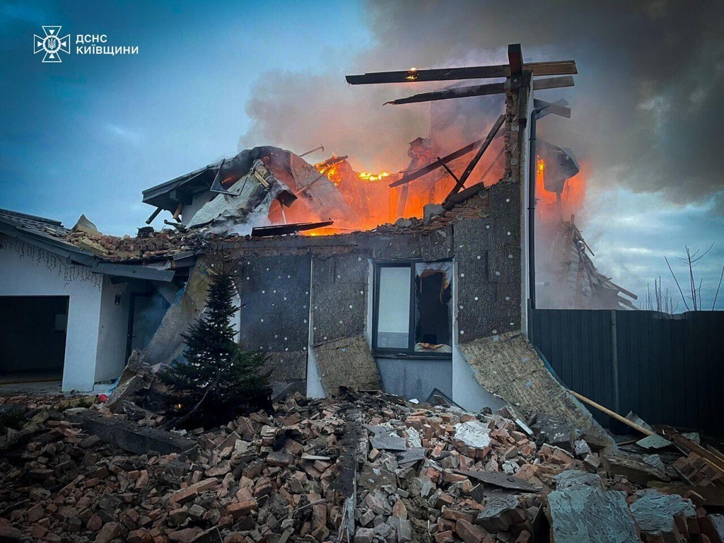 In this photo provided by the Ukrainian Emergency Service on Tuesday, Dec. 23, 2025, a residential house burns after a Russian strike in Kyiv region, Ukraine. (Ukrainian Emergency Service via AP)