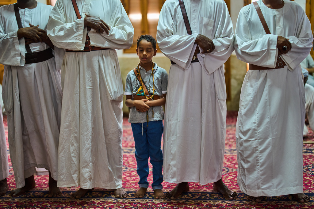 Muslims perform zikr, a Sufi devotional practice, inside the war-damaged Sheikh GaribAllah Mosque in Omdurman, on the outskirts of Khartoum, Sudan, Friday, April 24, 2026. (AP Photo/Bernat Armangue)