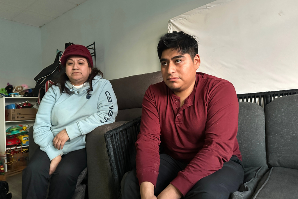 Angelica Fisher, left, and Cristian Vaca pose for a photo Thursday, Jan. 22, 2026, at his home in Biddeford, Maine. (AP Photo/Patrick Whittle)