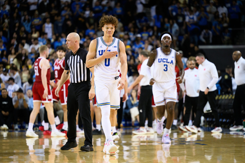 UCLA guard Trent Perry (0) gestures during the first half of an NCAA college basketball game against Nebraska, Tuesday, March 3, 2026, in Los Angeles. (AP Photo/William Liang)