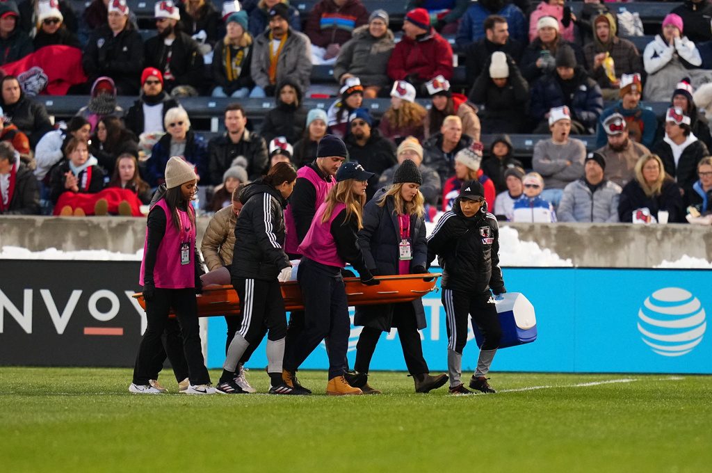 Japan defender Hikaru Kitagawa is taken off the pitch by trainers after sustaining an injury during the first half of an international friendly soccer match against the United States, Friday, April 17, 2026, in Commerce City, Colo. (AP Photo/Jack Dempsey)