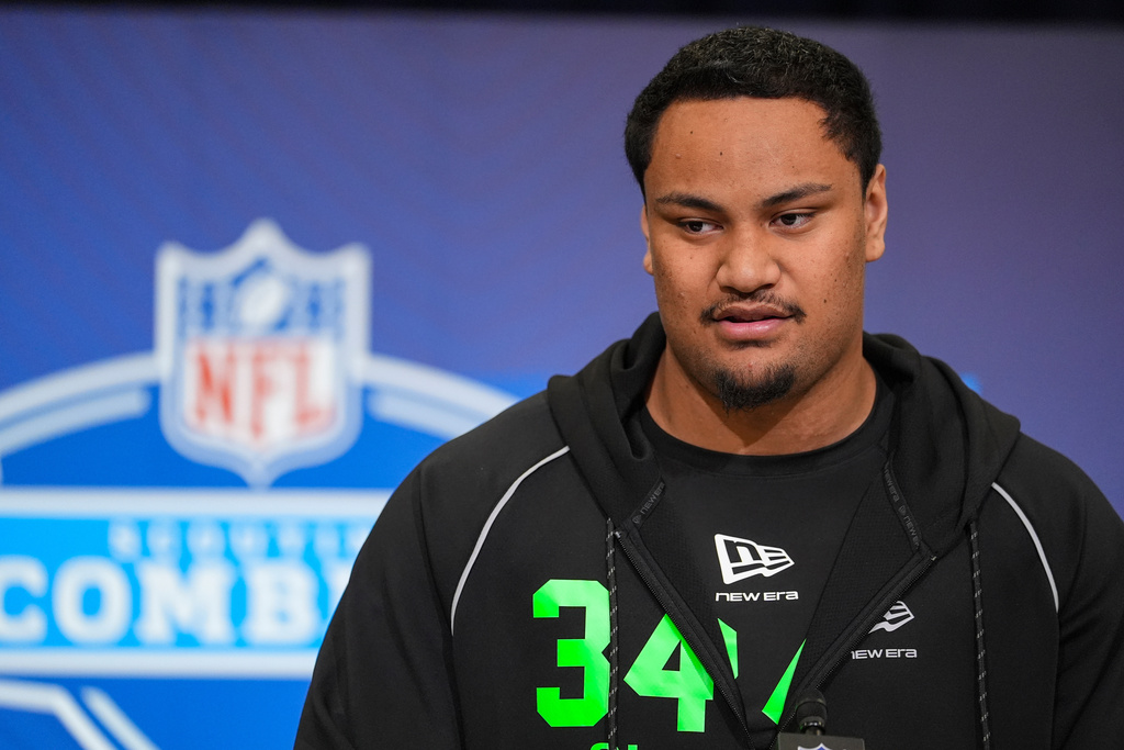 Miami offensive lineman Francis Mauigoa (34) speaks during a press conference at the NFL football scouting combine in Indianapolis, Saturday, Feb. 28, 2026. (AP Photo/Michael Conroy)