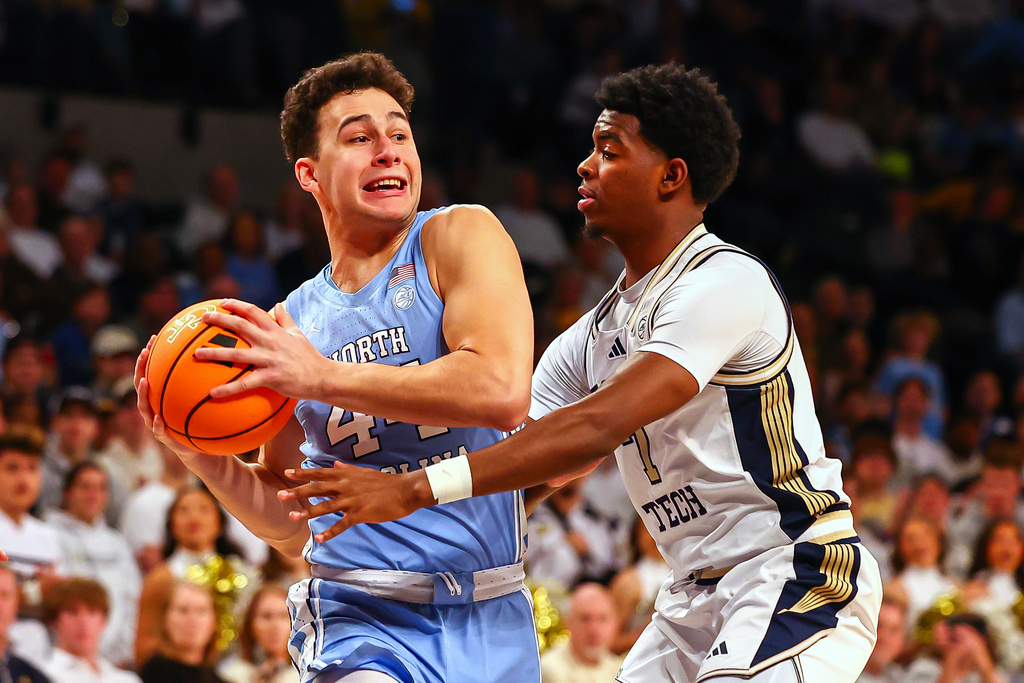 North Carolina guard Luka Bogavac (44) dribbles against Georgia Tech guard Chas Kelley III (7) during the first half of an NCAA college basketball game, Saturday, Jan. 31, 2026, in Atlanta. (AP Photo/Colin Hubbard)