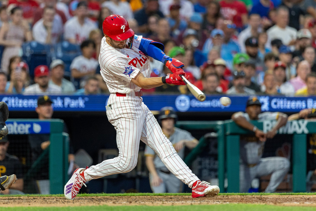 Philadelphia Phillies' Trea Turner hits an RBI double in the seventh inning of a baseball game against the Pittsburgh Pirates, Tuesday, June 30, 2026, in Philadelphia. (AP Photo/Laurence Kesterson)