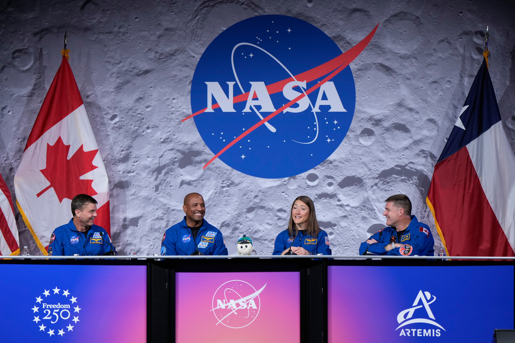 NASA's Artemis II crew - NASA astronauts Reid Wiseman, Victor Glover, and Christina Koch, and Canadian Space Agency (CSA) astronaut Jeremy Hansen speak during a press conference on Thursday, April 16, 2026, in Houston. (AP Photo/Ashley Landis)