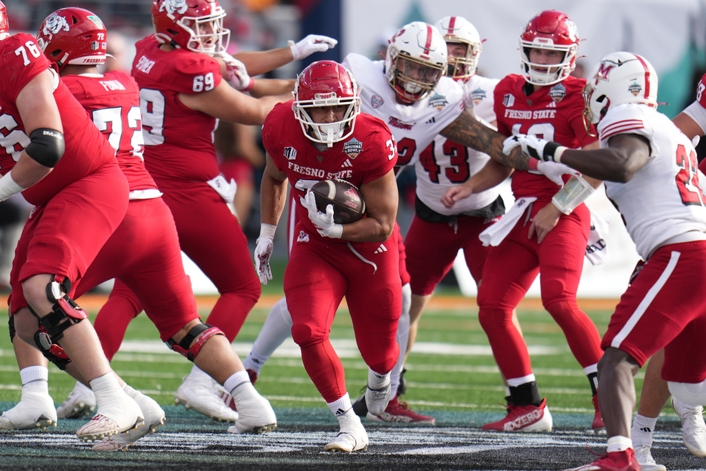 Fresno State running back Brandon Ramirez (31) runs the ball against Miami in the first half of the Snoop Dogg Arizona Bowl NCAA college football game, Saturday, Dec. 27, 2025, in Tucson, Ariz. (AP Photo/Rick Scuteri)