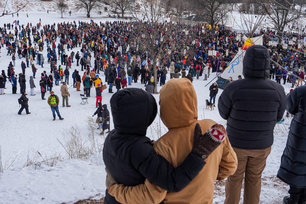 People gather for a memorial honoring Renee Good, who was fatally shot by a federal agent, in Minneapolis, Saturday, Feb. 7, 2026, . (AP Photo/Ryan Murphy)