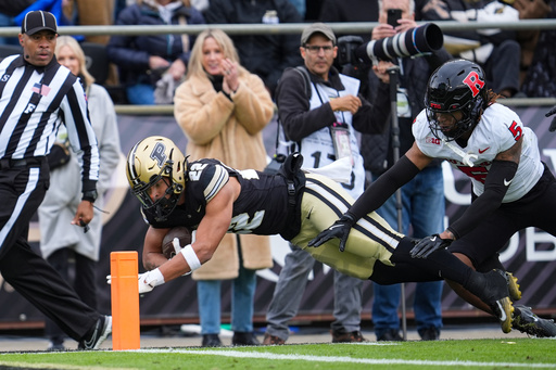 Purdue running back Antonio Harris (22) dives short of the goal line in front of Rutgers defensive back Kaj Sanders (5) during the second half of an NCAA college football game in West Lafayette, Ind., Saturday, Oct. 25, 2025. (AP Photo/Michael Conroy) Purdue running back Antonio Harris (22) dives short of the goal line in front of Rutgers defensive back Kaj Sanders (5) during the second half of an NCAA college football game in West Lafayette, Ind., Saturday, Oct. 25, 2025. (AP Photo/Michael Conroy)