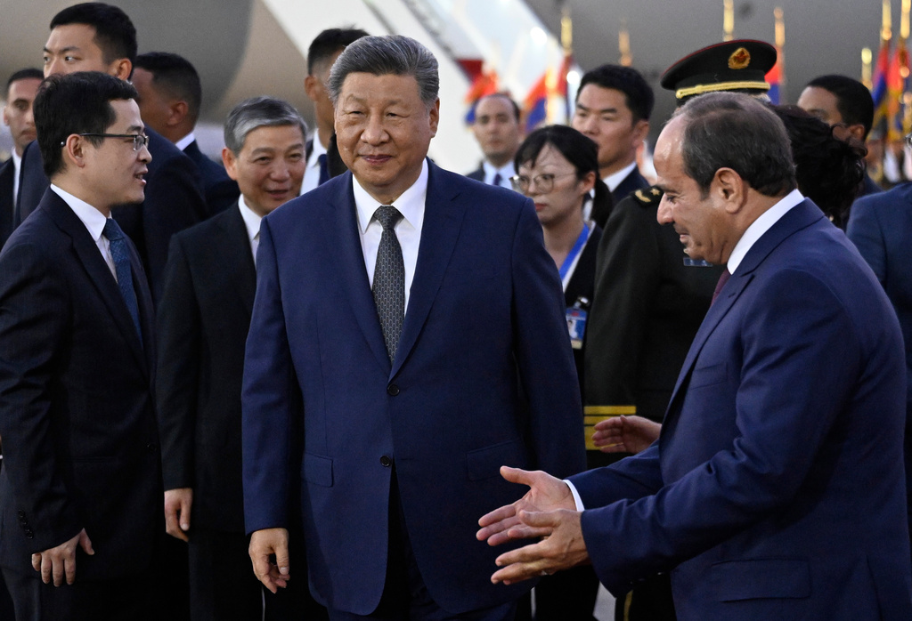 Chinese President Xi Jinping, centre, is welcomed by Egyptian President Abdel-Fattah el-Sissi, right, at Cairo International Airport in Cairo, Egypt, Tuesday, Sept. 1, 2026. (Khaled Desouki/Pool Photo via AP)