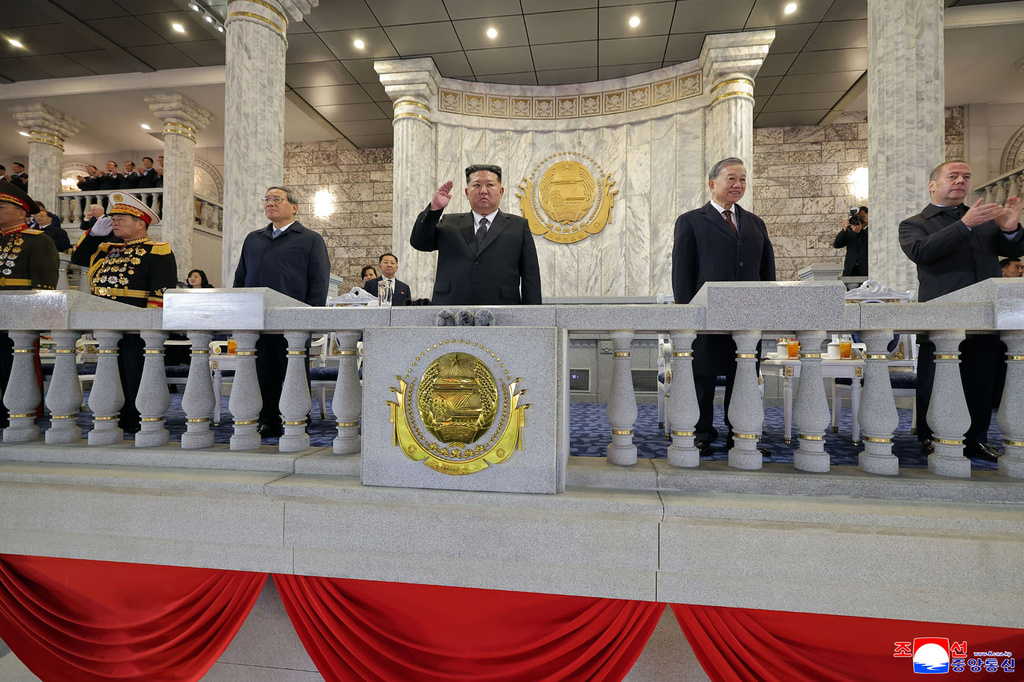 In this photo provided by North Korean government, North Korean leader Kim Jong Un, center, Chinese Premier Li Qiang, fourth right, Vietnamese Communist Party General Secretary To Lam, second right, Russian Security Council Deputy Chairman Dmitry Medvedev, right, attend the military parade marking the 80th anniversary of the founding of the ruling Worker's Party, in Pyongyang, North Korea, Friday, Oct. 10, 2025. Independent journalists were not given access to cover the event depicted in this image distributed by the North Korean government. The content of this image is as provided and cannot be independently verified. Korean language watermark on image as provided by source reads: "KCNA" which is the abbreviation for Korean Central News Agency. (Korean Central News Agency/Korea News Service via AP)