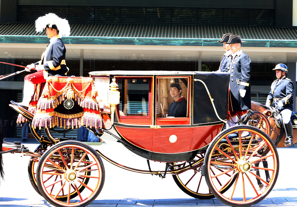 Japanese Prince Hisahito, son of Crown Prince Akishino, wearing ancient ceremonial costume, leaves for a ceremony by a carriage at the Imperial Palace in Tokyo Saturday, Sept. 6, 2025 as he celebrated his 19th birthday and attended the coming-of-age ceremony at the palace. (Yoshikazu Tsuno/Pool Photo via AP)