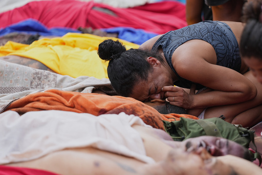 A woman mourns over the bodies of people killed the day before during a police raid targeting the Comando Vermelho gang in the Complexo da Penha favela of Rio de Janeiro, Brazil, Wednesday, Oct. 29, 2025. (AP Photo/Silvia Izquierdo) A woman mourns over the bodies of people killed the day before during a police raid targeting the Comando Vermelho gang in the Complexo da Penha favela of Rio de Janeiro, Brazil, Wednesday, Oct. 29, 2025. (AP Photo/Silvia Izquierdo)