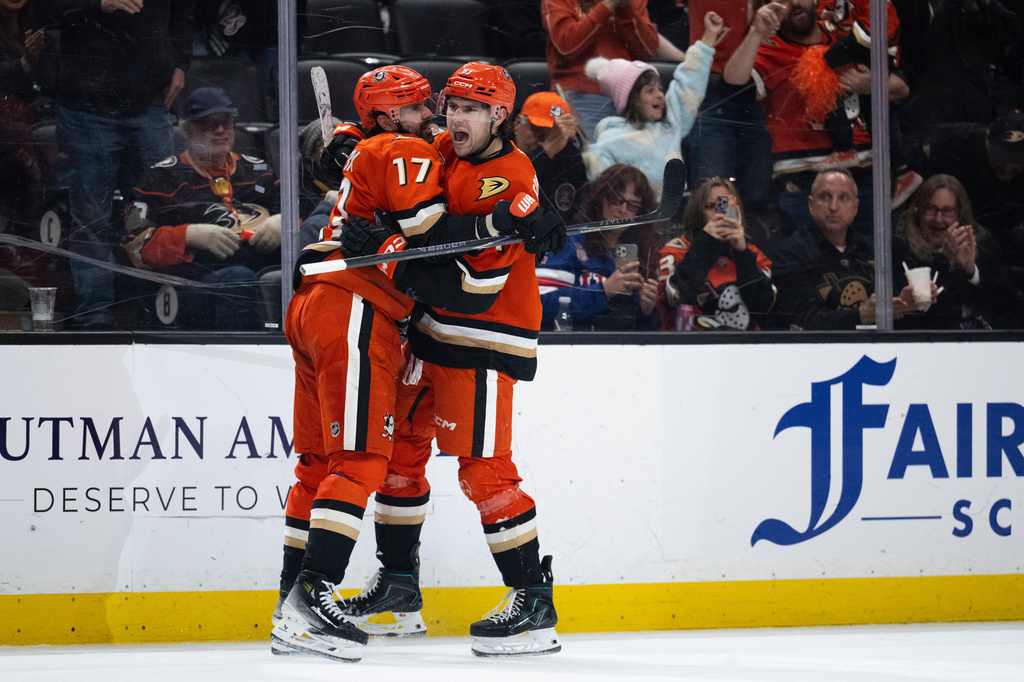 Anaheim Ducks left wing Cutter Gauthier, right, celebrates his goal with left wing Alex Killorn during the third period of an NHL hockey game against the Vancouver Canucks, Sunday, April 12, 2026, in Anaheim, Calif. (AP Photo/Kyusung Gong)
