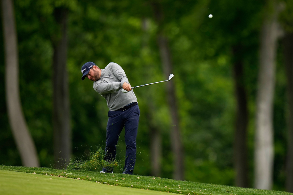 Jordan Smith, of England, hits from the rough on the 10th hole during the first round of the PGA Championship golf tournament practice round at Aronimink Golf Club, Thursday, May 14, 2026, in Newtown Square, PA. (AP Photo/Frank Franklin II)