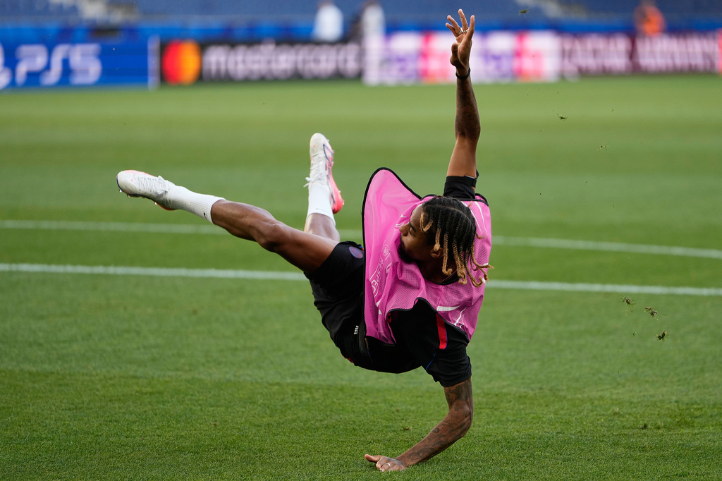 PSG's Bradley Barcola attempts a kick during a training session ahead of the UEFA Super Cup soccer match against Aston Villa in Salzburg, Austria, Tuesday, Aug. 11, 2026. (AP Photo/Darko Bandic)