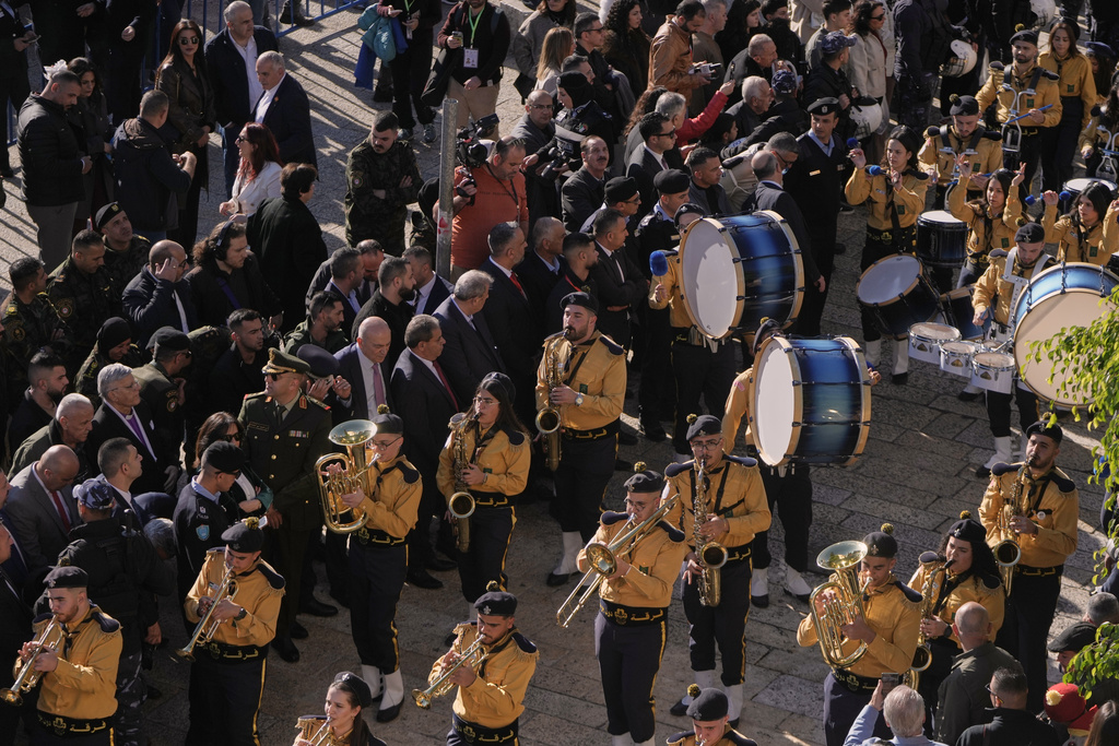Palestinian scout bands parade at the Manger Square near the Church of the Nativity, traditionally believed to be the birthplace of Jesus, on Christmas Eve, in the West Bank city of Bethlehem, Wednesday, Dec. 24, 2025. (AP Photo/Mahmoud Illean)