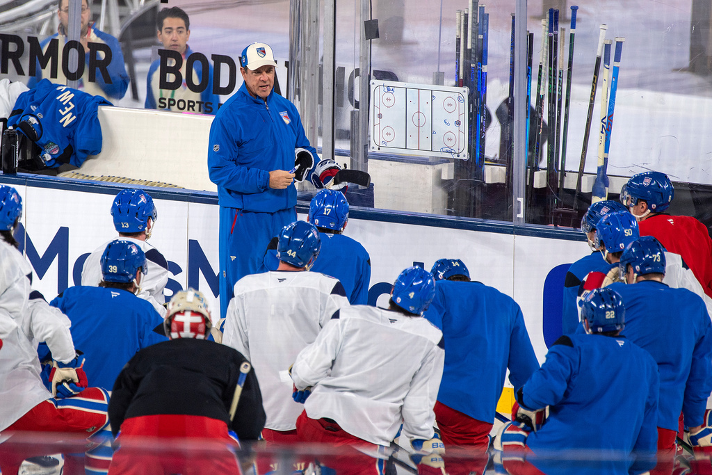 New York Rangers coach Mike Sullivan talks to his team during practice for the NHL Winter Classic outdoor hockey game, Thursday, Jan. 1, 2026, in Miami. (AP Photo/Michael Laughlin)