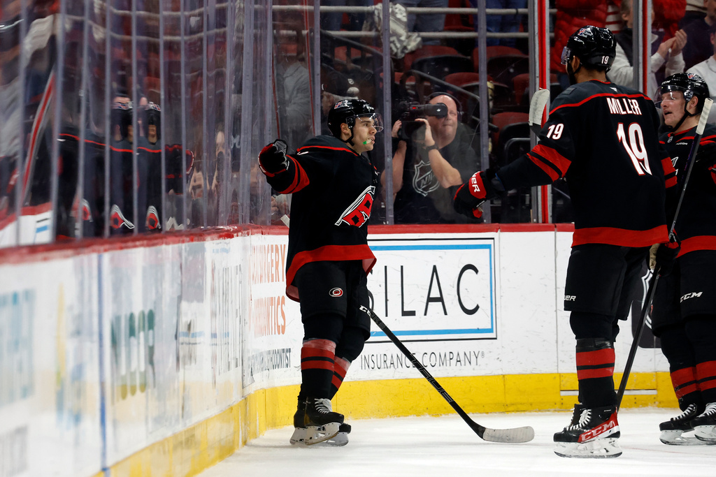 Carolina Hurricanes' Logan Stankoven (22) celebrates his goal against the Dallas Stars during the first period of an NHL hockey game in Raleigh, N.C., Tuesday, Jan. 6, 2026. (AP Photo/Karl DeBlaker)
