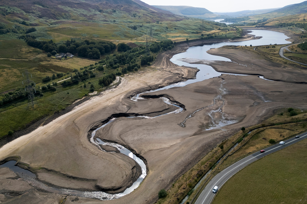 FILE - Woodhead reservoir is visible amid a drought near Manchester, England, Thursday, Aug. 13, 2026. (AP Photo/Jon Super, File)