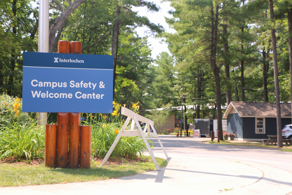 This photo provided by Interlochen Public Radio shows a sign directing visitors to the Interlochen Center for the Arts Tuesday, July 28, 2026, in Interlochen, Mich. (Austin Rowlader/Interlochen Public Radio via AP)
