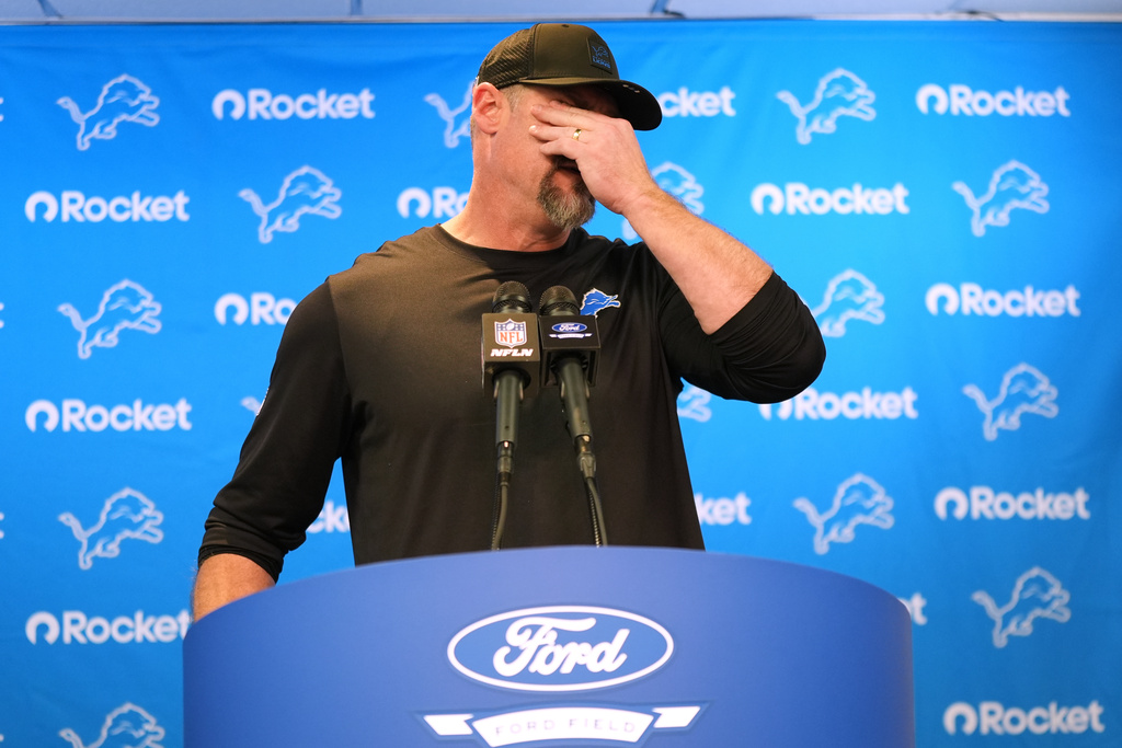 Detroit Lions head coach Dan Campbell wipes his face during a news conference after an NFL football game against the Pittsburgh Steelers, Sunday, Dec. 21, 2025, in Detroit. (AP Photo/Ryan Sun)