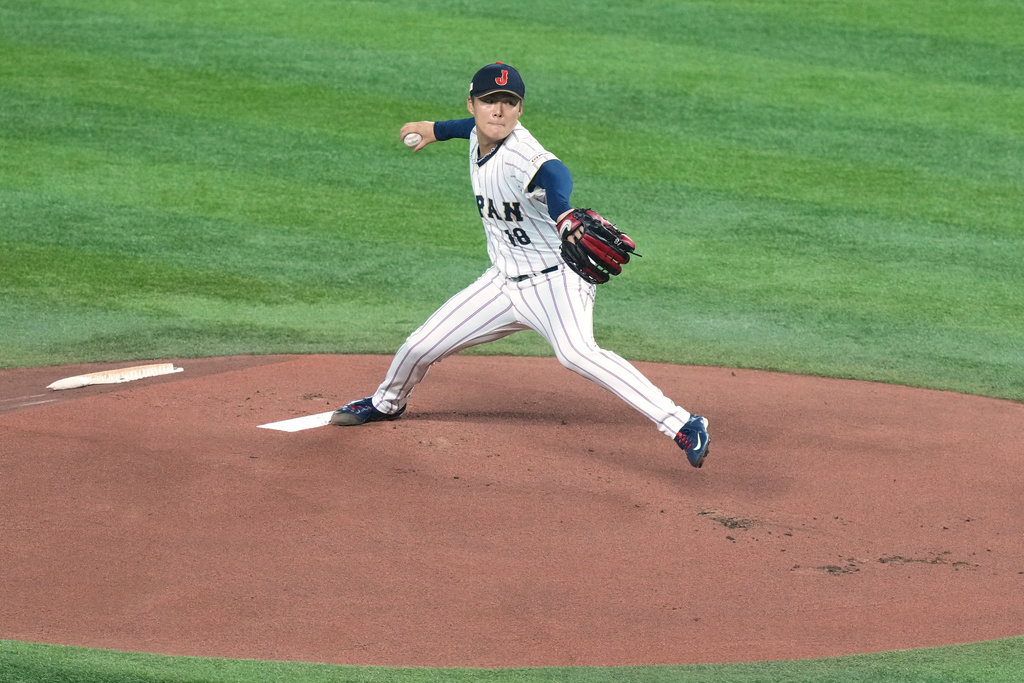 Japan's pitcher Yoshinobu Yamamoto delivers a pitch during the first inning of a World Baseball Classic quarterfinal game, Saturday, March 14, 2026, in Miami. (AP Photo/Marta Lavandier)
