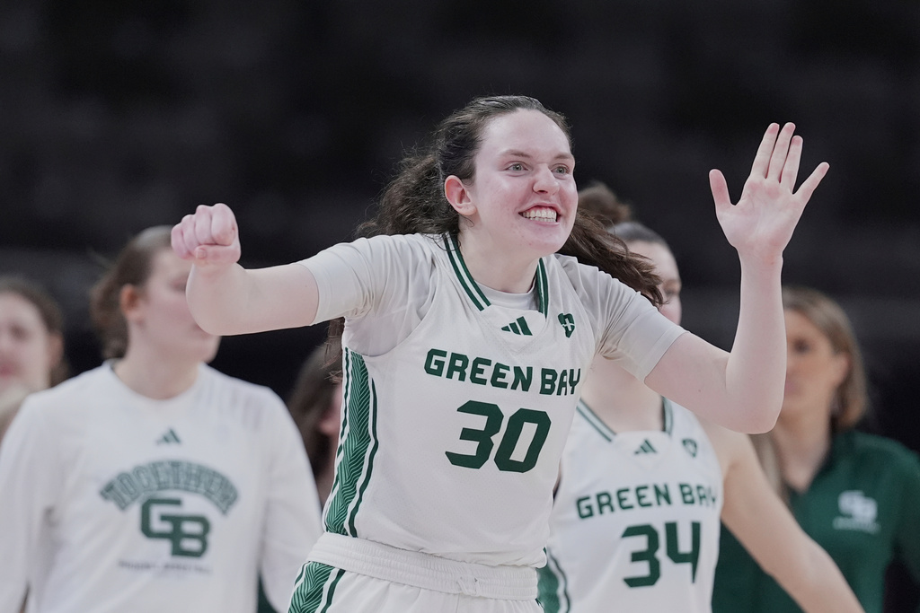 FILE - Green Bay center Jenna Guyer (30) celebrates as Purdue Fort Wayne calls a time out in the second half of an NCAA college basketball game in the championship of the Horizon League tournament in Indianapolis, March 11, 2025. (AP Photo/Michael Conroy, file)