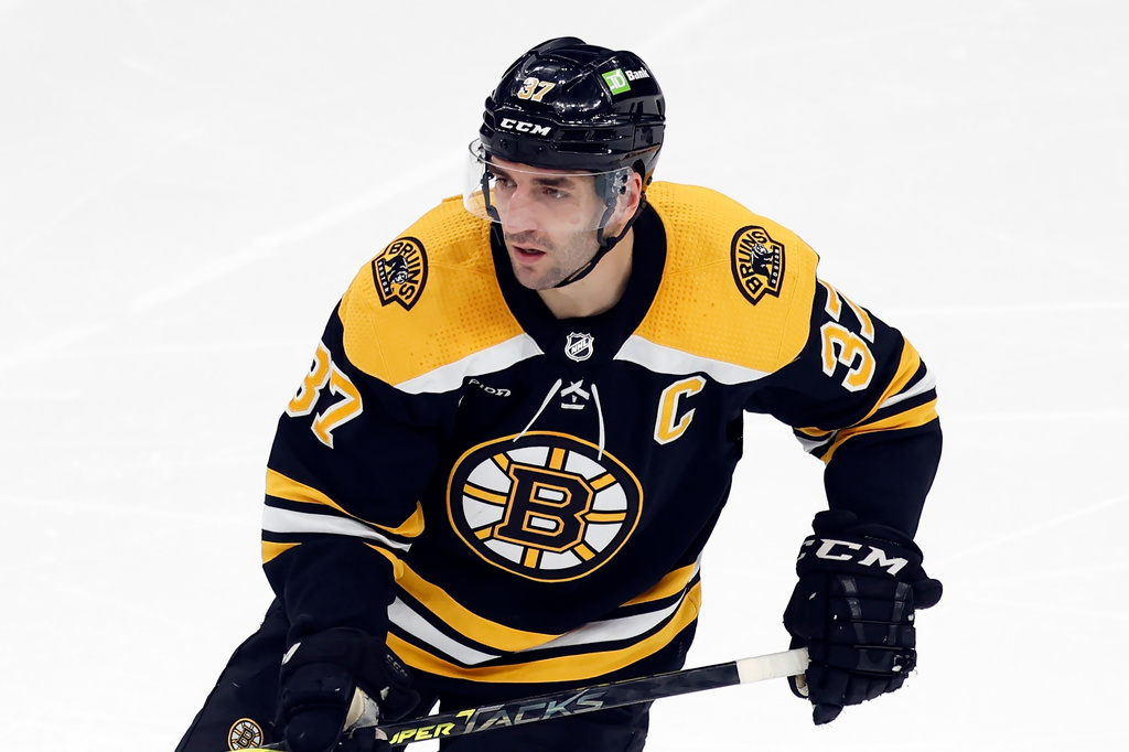 FILE - Boston Bruins' Patrice Bergeron plays against the Tampa Bay Lightning during the second period of an NHL hockey game, March 25, 2023, in Boston. (AP Photo/Michael Dwyer, File)