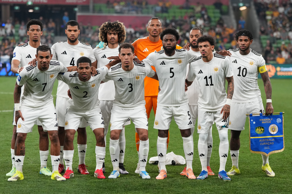 Curacao pose for a team photo ahead of their international soccer friendly against Australia in Melbourne, Australia, Tuesday, March 31, 2026. (AP Photo/Asanka Brendon Ratnayake)