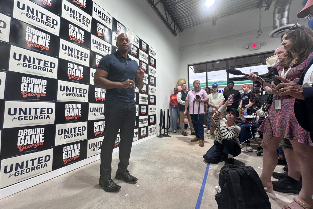 Maryland Gov. Wes Moore campaigns for Georgia Sen. Jon Ossoff, D-Ga., and Democratic gubernatorial nominee Keisha Lance Bottoms, Tuesday, July 14, 2026, in Atlanta. (AP Photo/Bill Barrow)