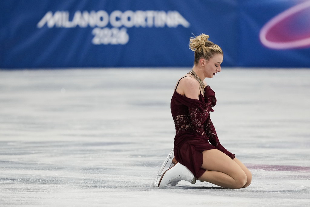 Amber Glenn of the United States competes during the women's short program figure skating at the 2026 Winter Olympics, in Milan, Italy, Tuesday, Feb. 17, 2026. (AP Photo/Francisco Seco)