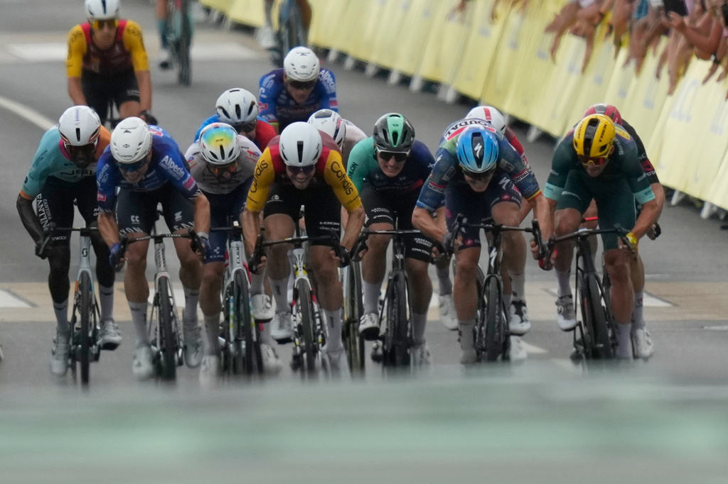 Riders sprint to the finish line of the twelfth stage of the Tour de France cycling race with start in Circuit Nevers Magny-Cours and finish in Chalon-sur-Saone, France, Thursday, July 16, 2026. (AP Photo/Mosa'ab Elshamy)