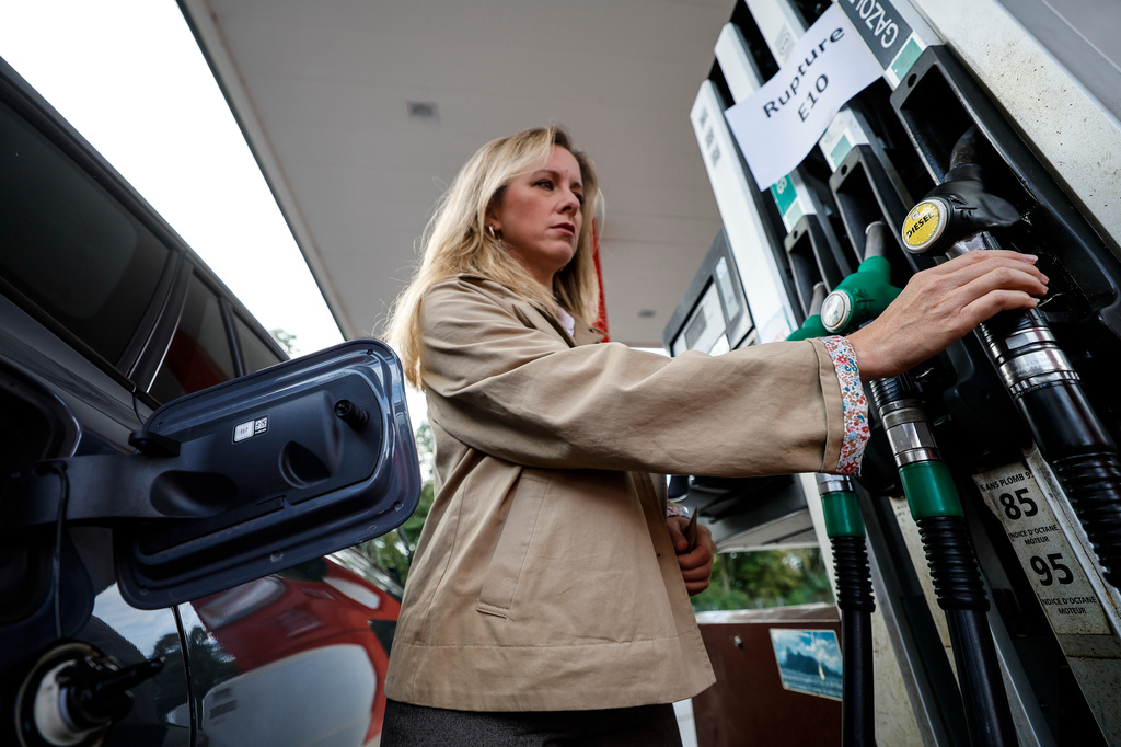 FILE - A customer fills her vehicle at a gas station, in Lille, France, Thursday Sept. 17, 2026. (AP Photo/Jean-Francois Badias, File)