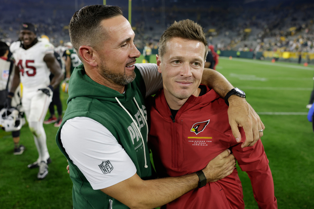 Green Bay Packers head coach Matt LaFleur talks to Arizona Cardinals head coach Mike LaFleur after a preseason NFL football game Friday, Aug. 28, 2026, in Green Bay, Wis. (AP Photo/Matt Ludtke)