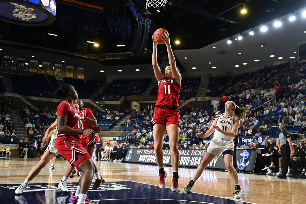 Louisville forward Elif Istanbulluoglu (11) grabs a rebound against UConn during the first half of a NCAA college basketball game, Tuesday, Nov. 4, 2025, in Annapolis, Md. (AP Photo/Gail Burton)