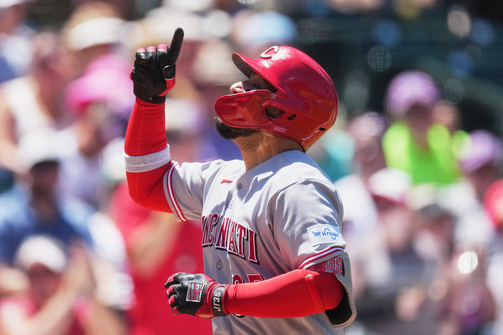 Cincinnati Reds' Jose Trevino gestures as he crosses home plate after hitting a solo home run off Colorado Rockies starting pitcher Tomoyuki Sugano in the third inning of a baseball game Saturday, July 18, 2026, in Denver. (AP Photo/David Zalubowski)