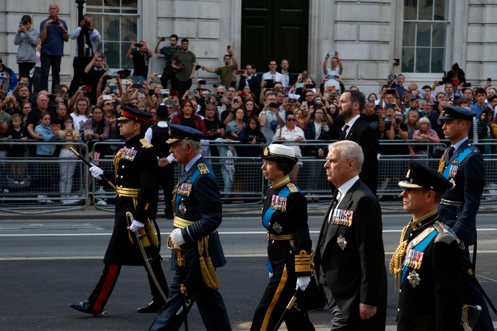 FILE - Britain's King Charles III, second left, Princess Anne, third right, Prince Andrew, second right, followed by Prince William, and Prince Harry, unseen, follow the coffin of Queen Elizabeth II during a procession from Buckingham Palace to Westminster Hall in London, Wednesday, Sept.14., 2022. (AP Photo/David Cliff, Pool, File)