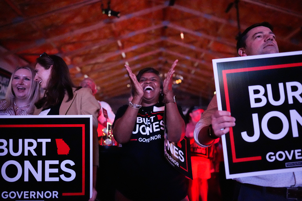 Supporters cheer as Georgia gubernatorial candidate Burt Jones speaks during a primary election night watch party, Tuesday, May 19, 2026, in Jackson, Ga. (AP Photo/Mike Stewart)