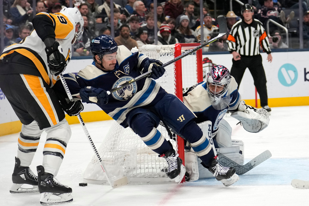 Pittsburgh Penguins right wing Anthony Mantha (39) Columbus Blue Jackets defenseman Denton Mateychuk (5) and goaltender Jet Greaves (73) battle for the puck during the second period of an NHL hockey game, Friday, Nov. 28, 2025, in Columbus, Ohio. (AP Photo/Carolyn Kaster)